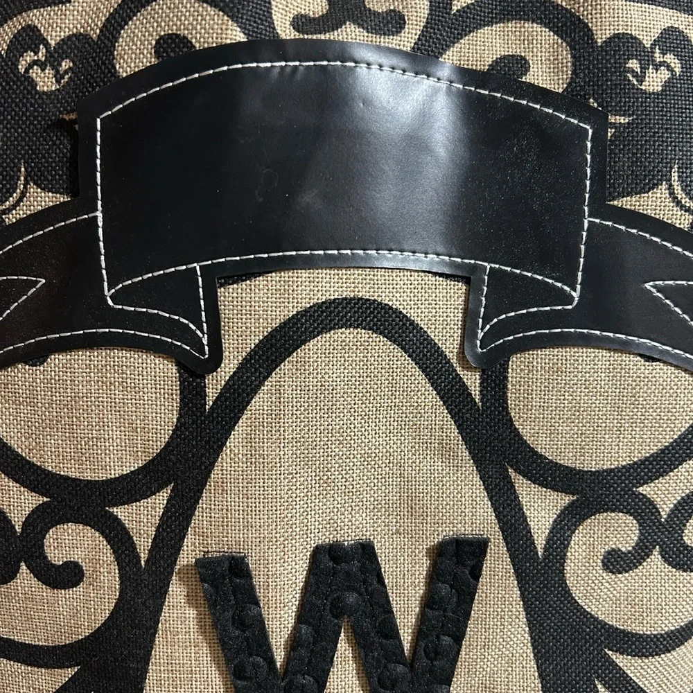Black and Tan Welcome Sign